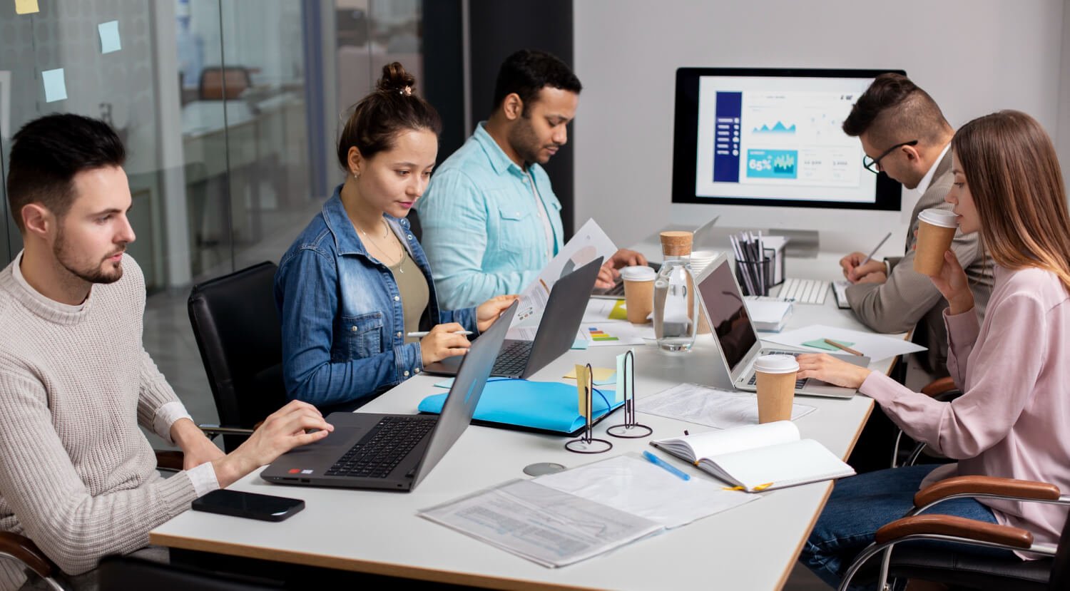 People using computer in estimation service provider office
